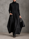 Vestido largo oversize con cuello alto y bolsillos